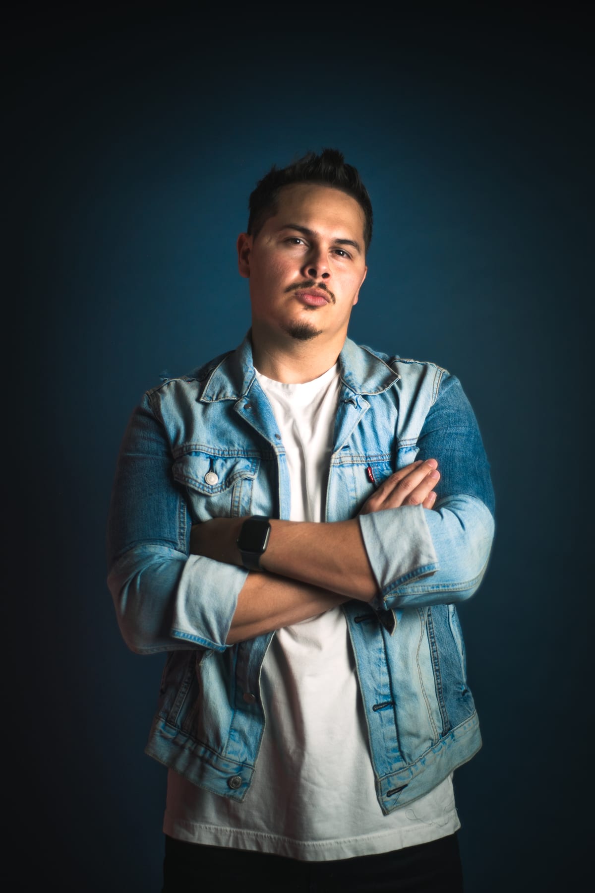 Hanstler in a denim jacket — moody studio portrait